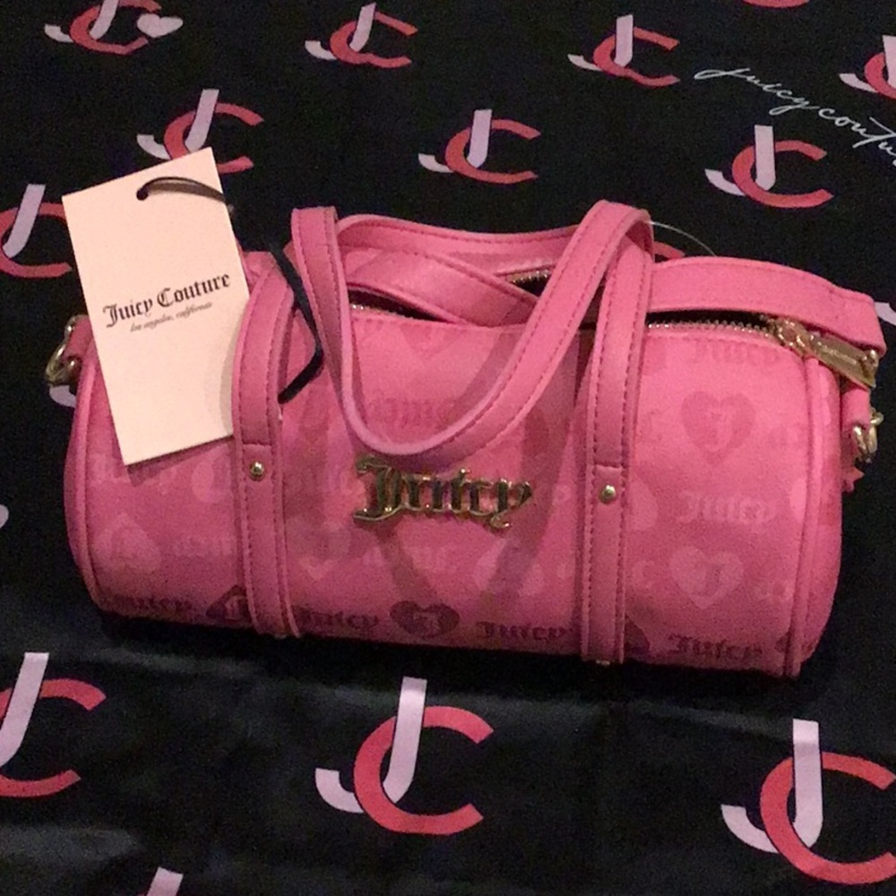 Juicy Couture hot pink mini Barrel bag with adjustable strap.
